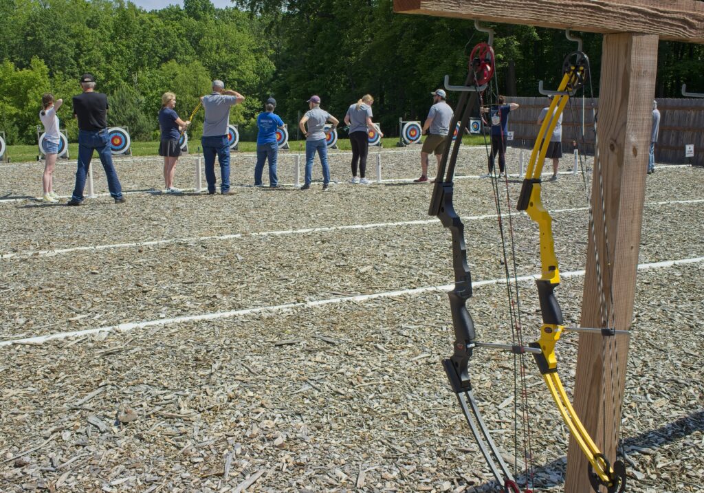 Women trying out archery